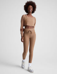 brown high-waisted midi leggings with a drawstring at waistband.