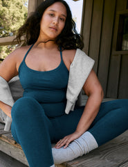 blue racerback cropped tank top with slim straps.