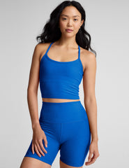 blue cropped length racerback cropped tank top with slim spaghetti straps.