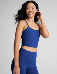 blue cropped tank top with slim spaghetti straps.