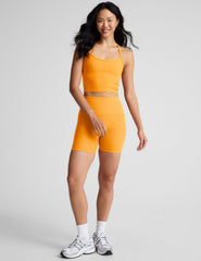orange racerback cropped tank top with spaghetti straps.