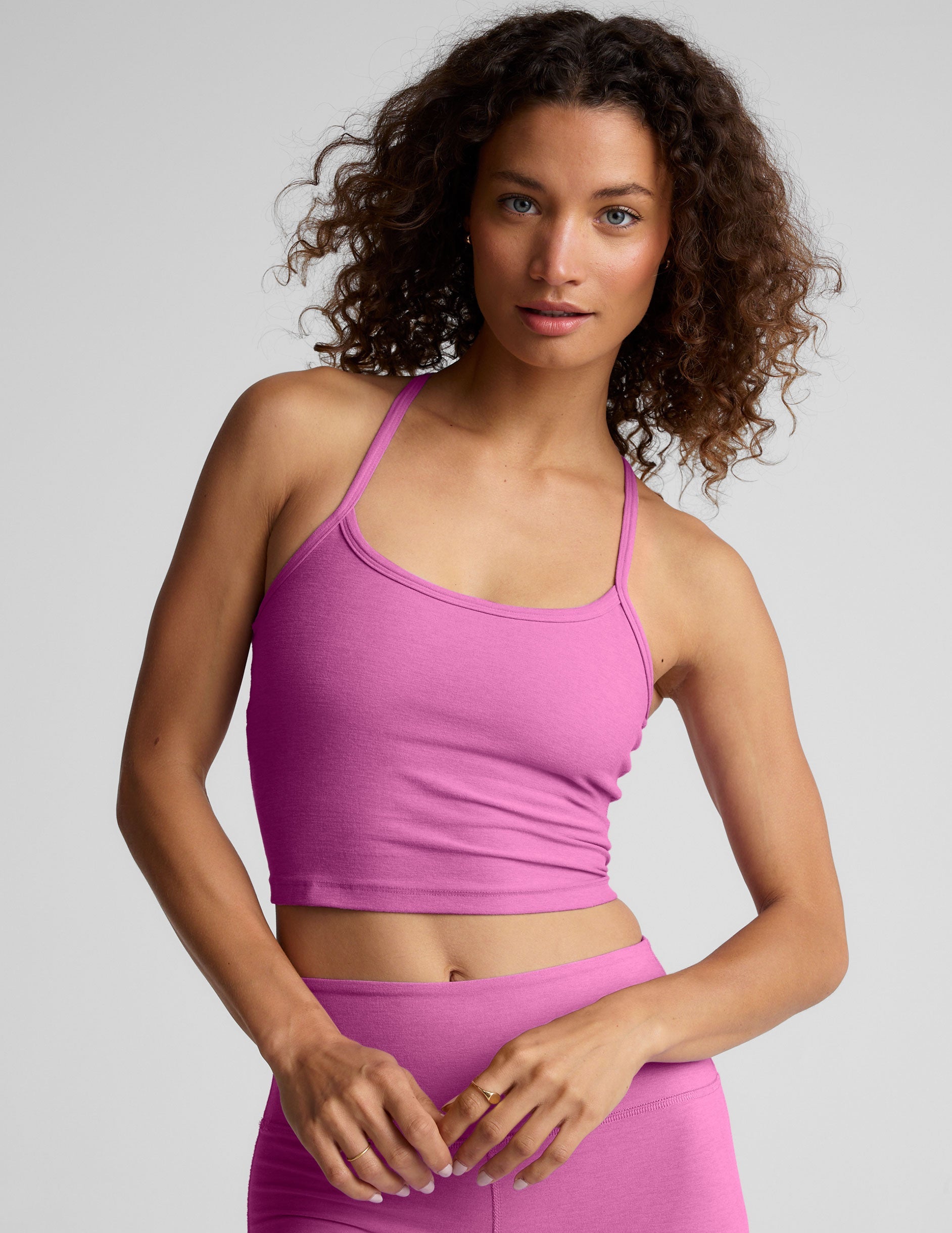 pink racerback cropped tank with slim straps.