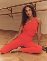 red one-shoulder cropped tank with an cut-out detail on the front strap and a twist detailing on the back strap.