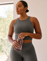 gray cropped tank top with a high scoop neckline.