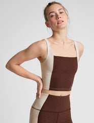 brown square neck cropped tank with white straps and white outlining down the sides.