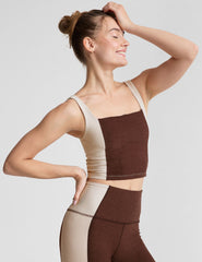 brown square neck cropped tank with white straps and white outlining down the sides.