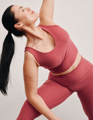 red cropped tank top with a front and back v neckline.