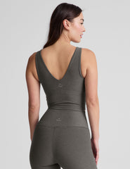 gray cropped length tank top with a front and back V neckline and self shelf bra. paired with high-waisted 5" inseam length biker shorts.