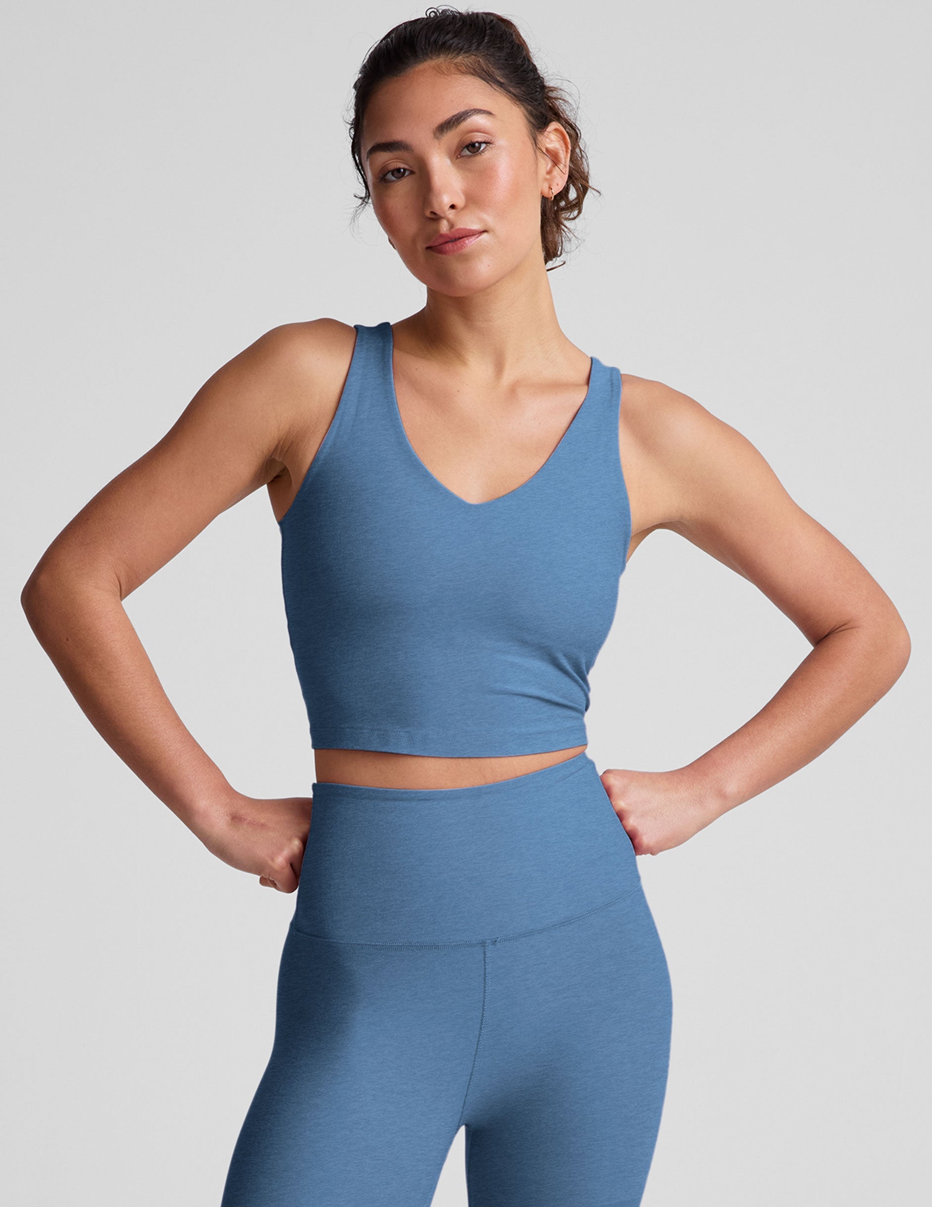 blue cropped tank with a soft front and back v neckline.