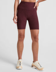 model is wearing red high-waisted 7" inseam biker shorts.