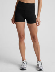 person wearing black 3" biker shorts on a plain background.