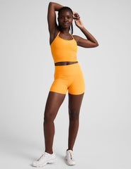 orange high-waisted 3" inseam biker shorts.