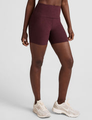 model is wearing red high-waisted 5" inseam biker shorts.