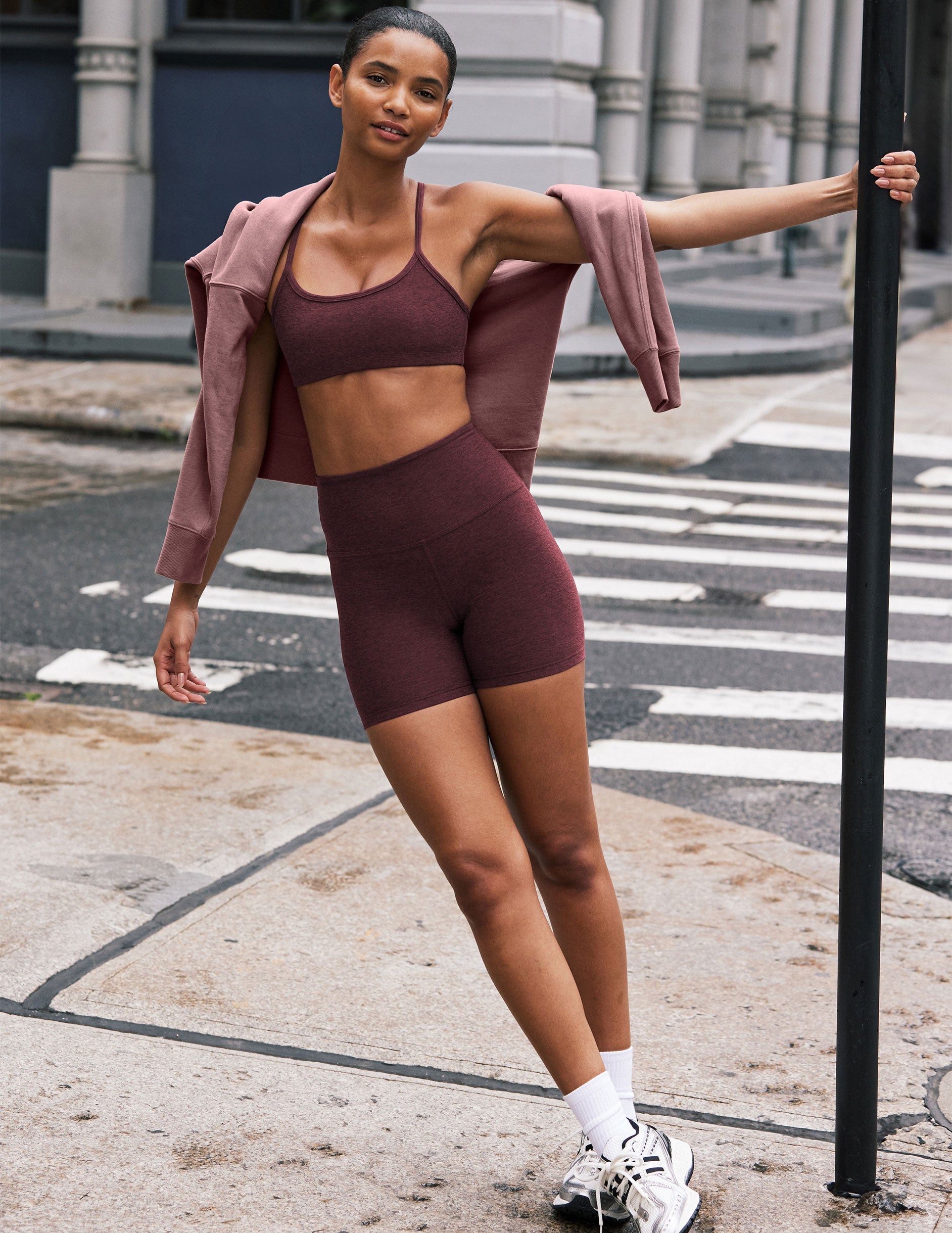 model is wearing red high-waisted 5" inseam biker shorts.