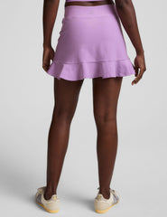purple high-waisted skirt with a ruffle hem and built-in shorts with pockets.
