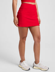 red mini athletic skirt with built-in shorts with pockets.