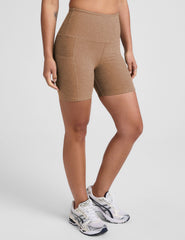 tan high-waisted 5" inseam biker shorts with pockets.