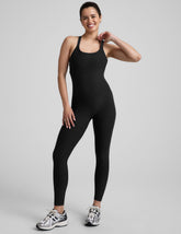 black midi length jumpsuit with cross straps on back.