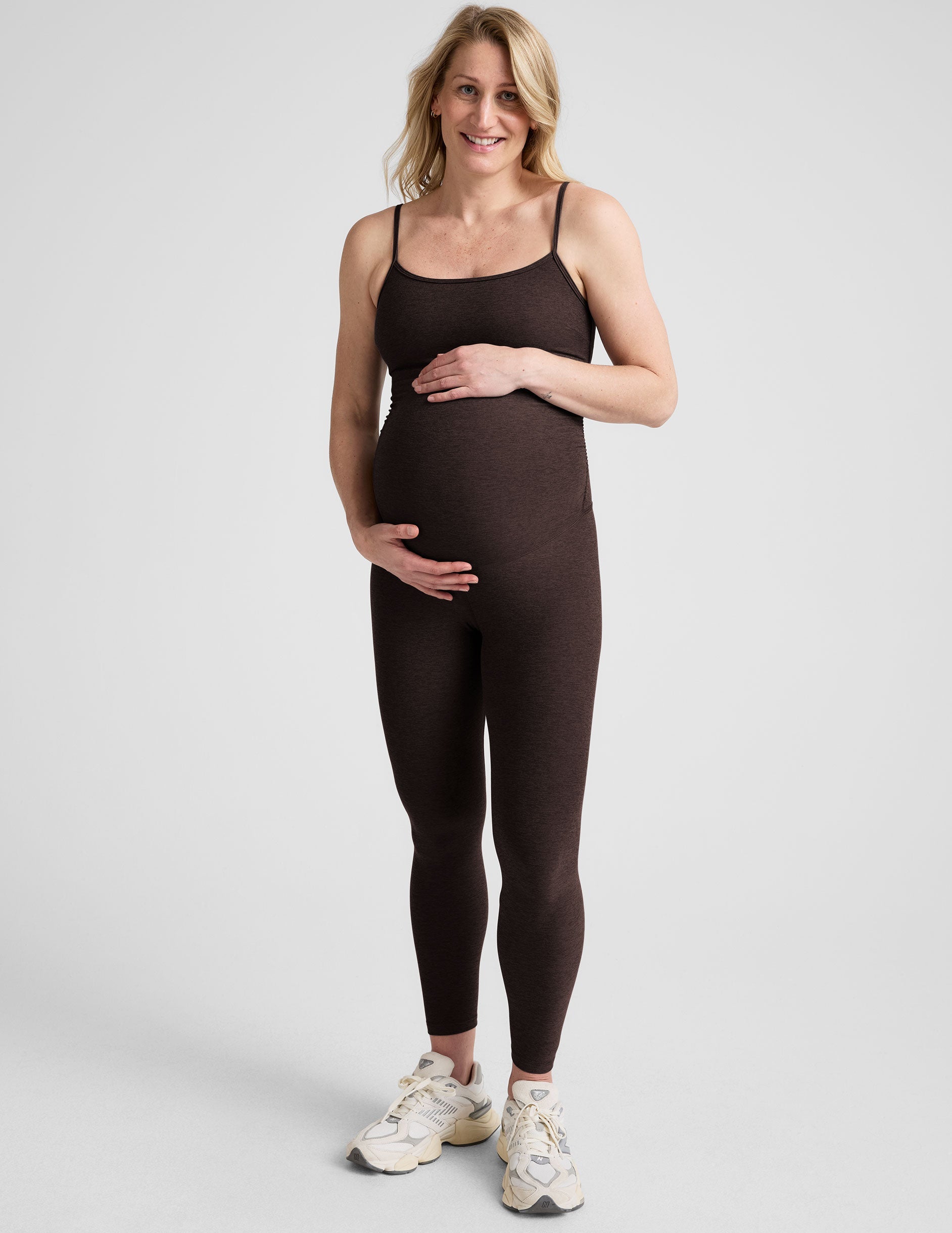 brown maternity midi length tank jumpsuit with adjustable straps.