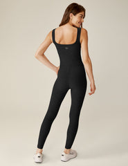 black square neck tank top midi jumpsuit with white lining on the sides.