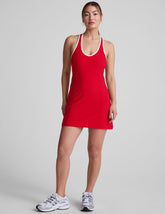 red mini dress with white trim and a back crossover strap detail.