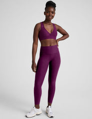 purple v-neck sports bra with remove-able pads.
