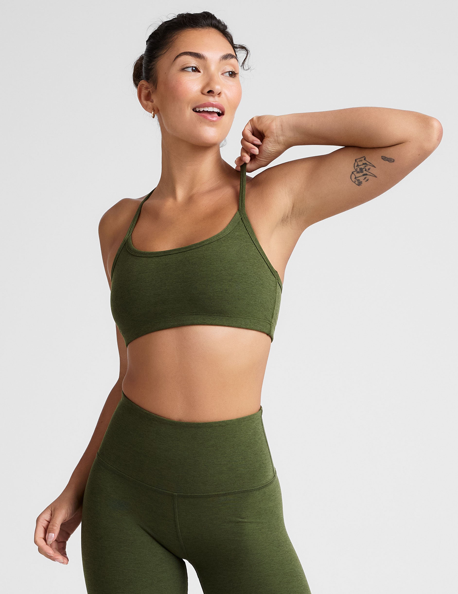 green racerback bra with thin straps.