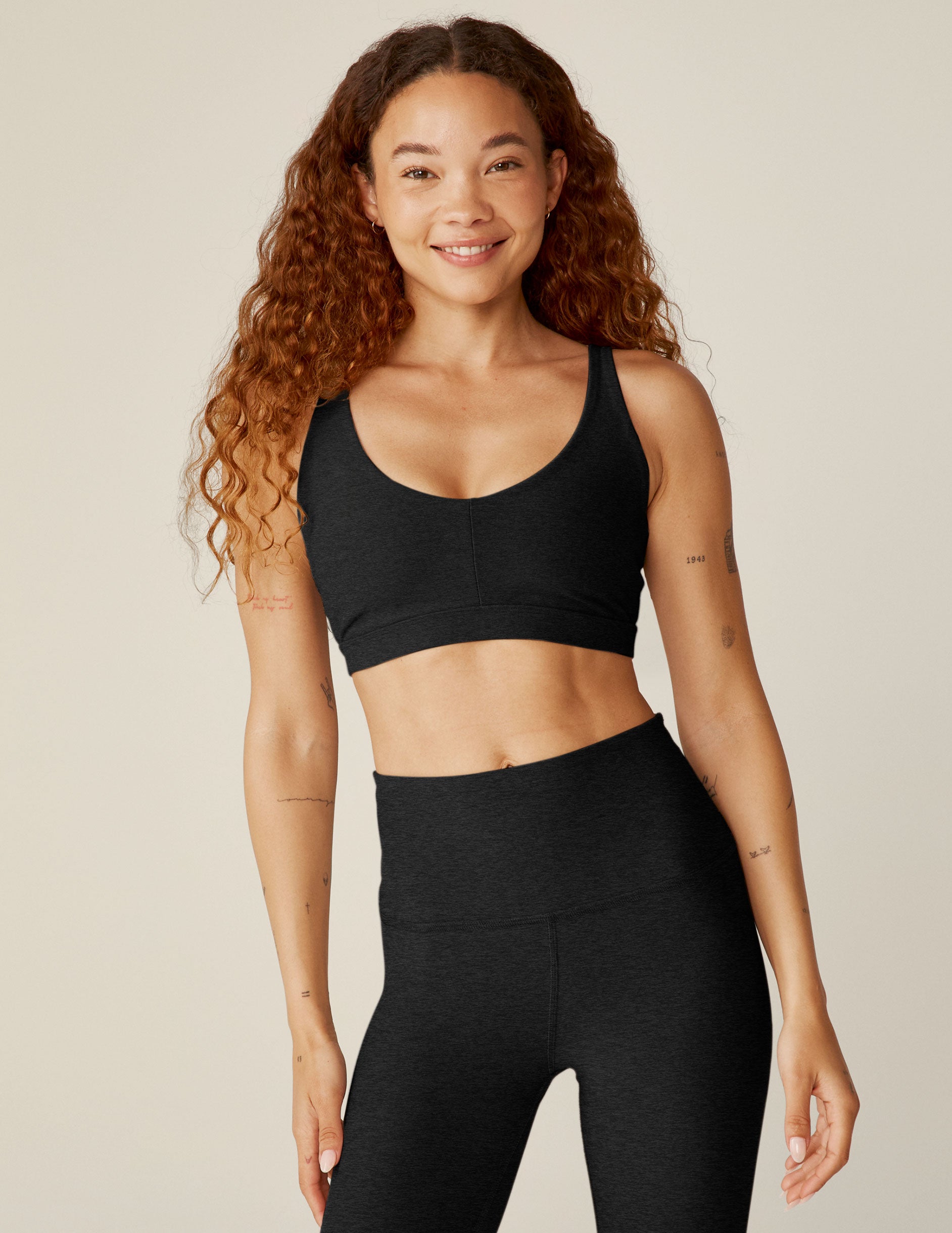 black sports bra with remove-able pads and adjusting straps.