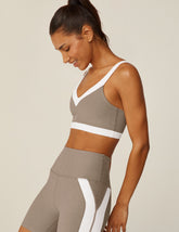 brown bra top with white outlining details.