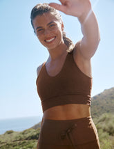 brown long line style bra with a v-neck in back and front.