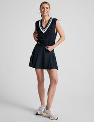 blue relaxed fit cable knit sweater vest with a v neckline with contrast color stripe.