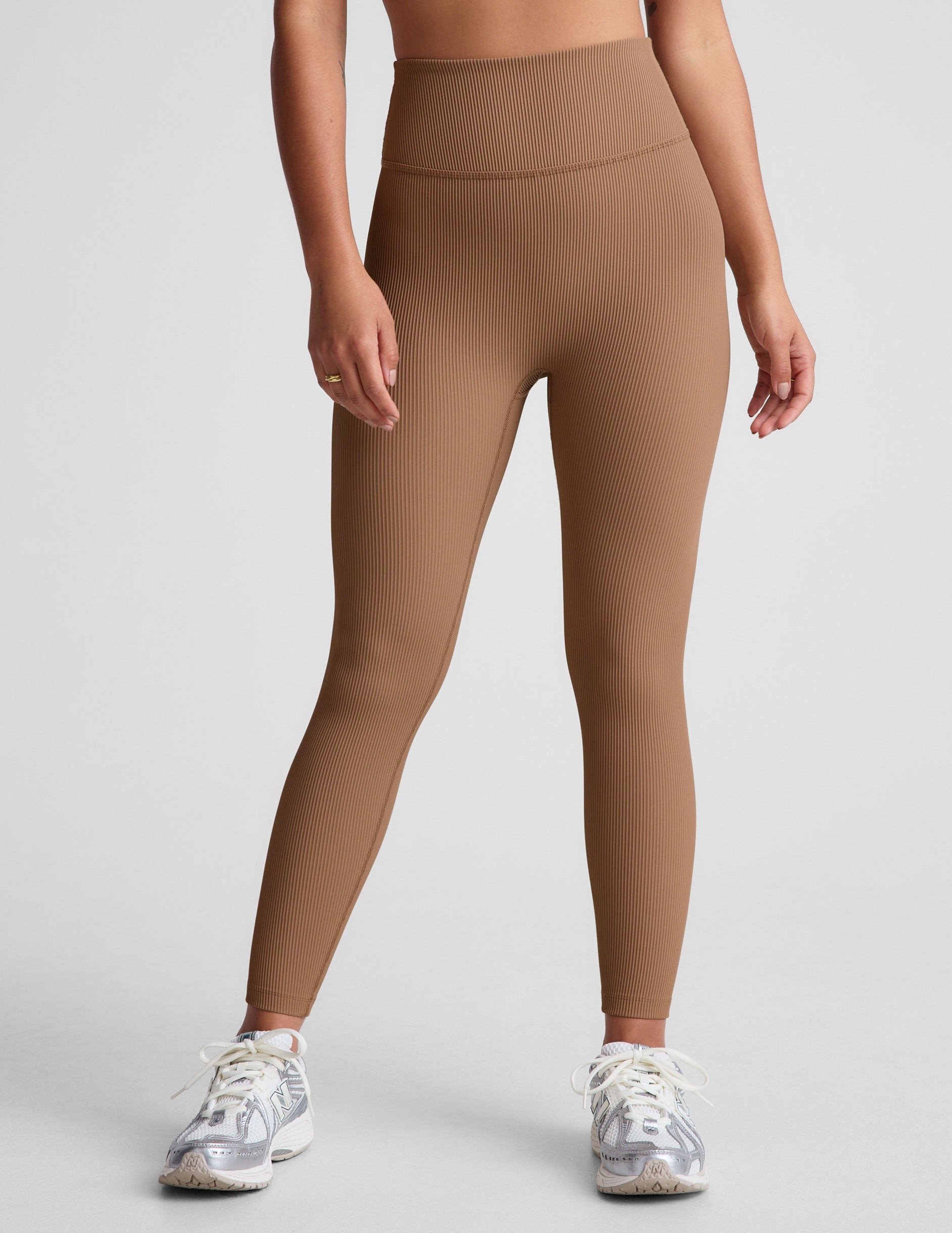 brown midi length leggings with a 4" waistband and no front rise seam. 