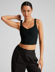 black ribbed cropped tank with a front and back v neckline.