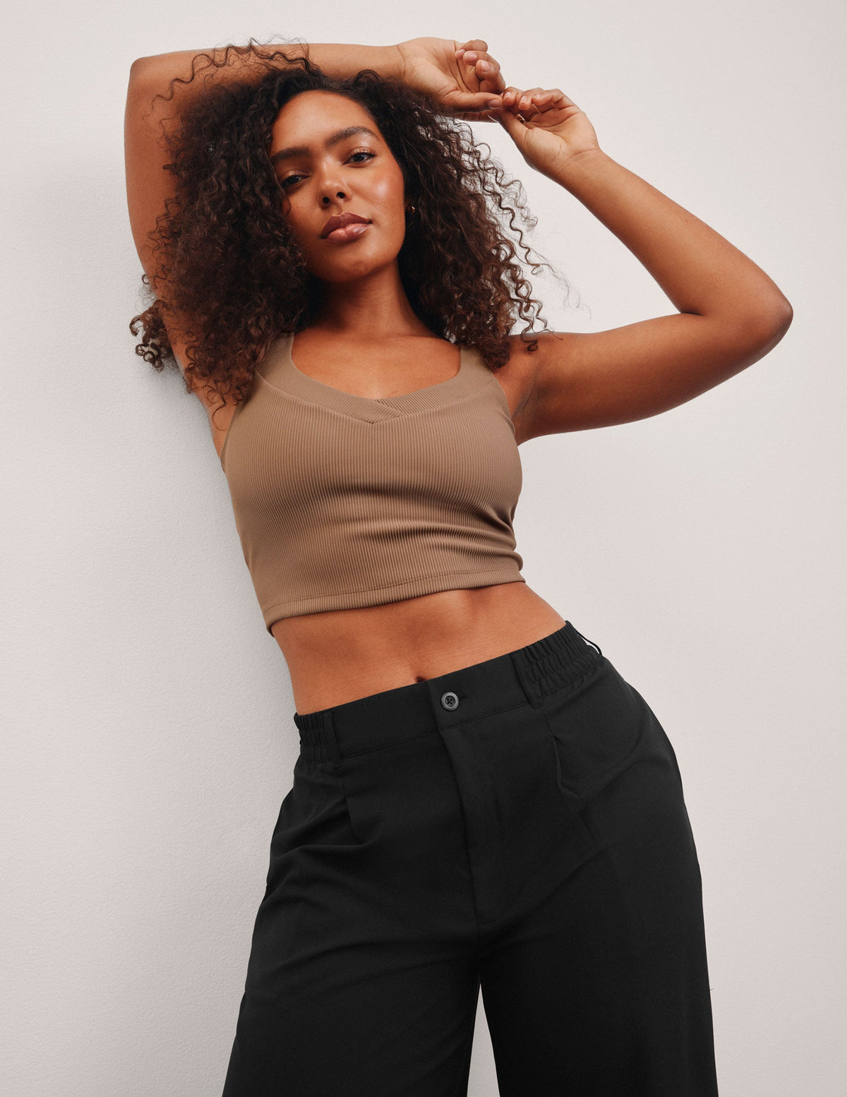 brown ribbed cropped tank with front and back v necklines.