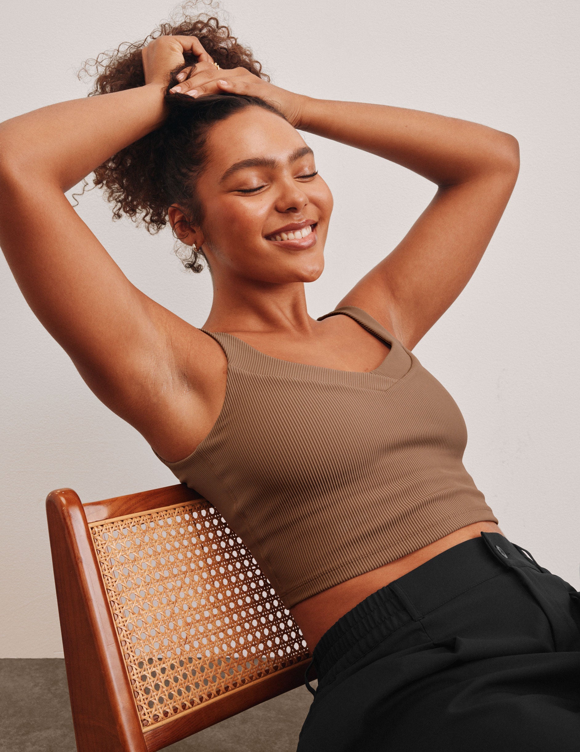 brown ribbed cropped tank with front and back v necklines.