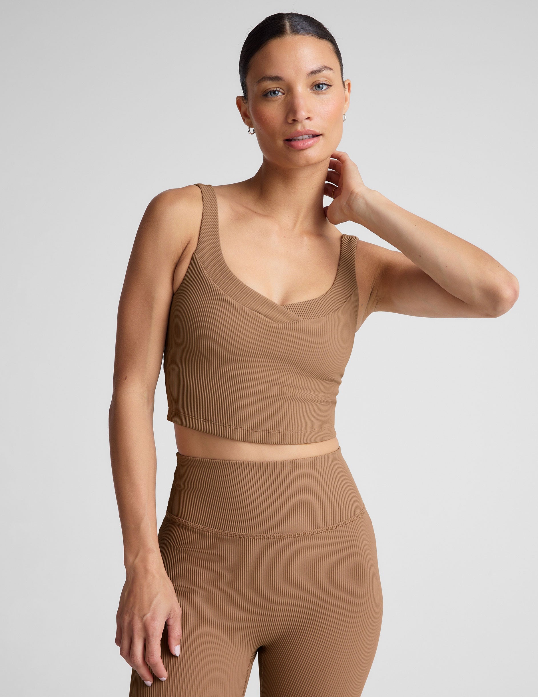 brown ribbed cropped tank with front and back v necklines.