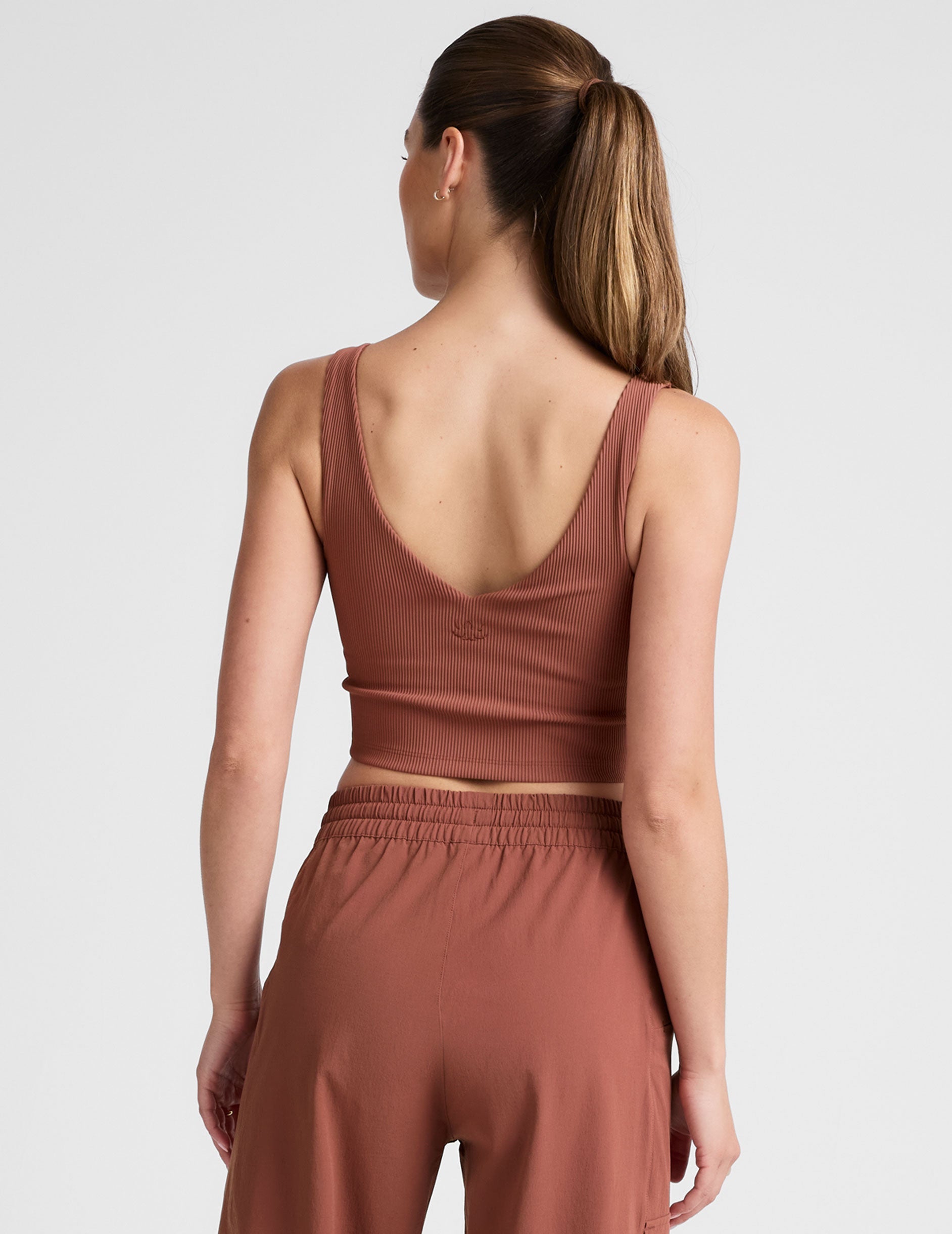 red ribbed cropped tank top with a soft front and back v neckline.