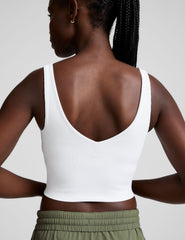 white ribbed cropped tank with a front and back soft v neckline.