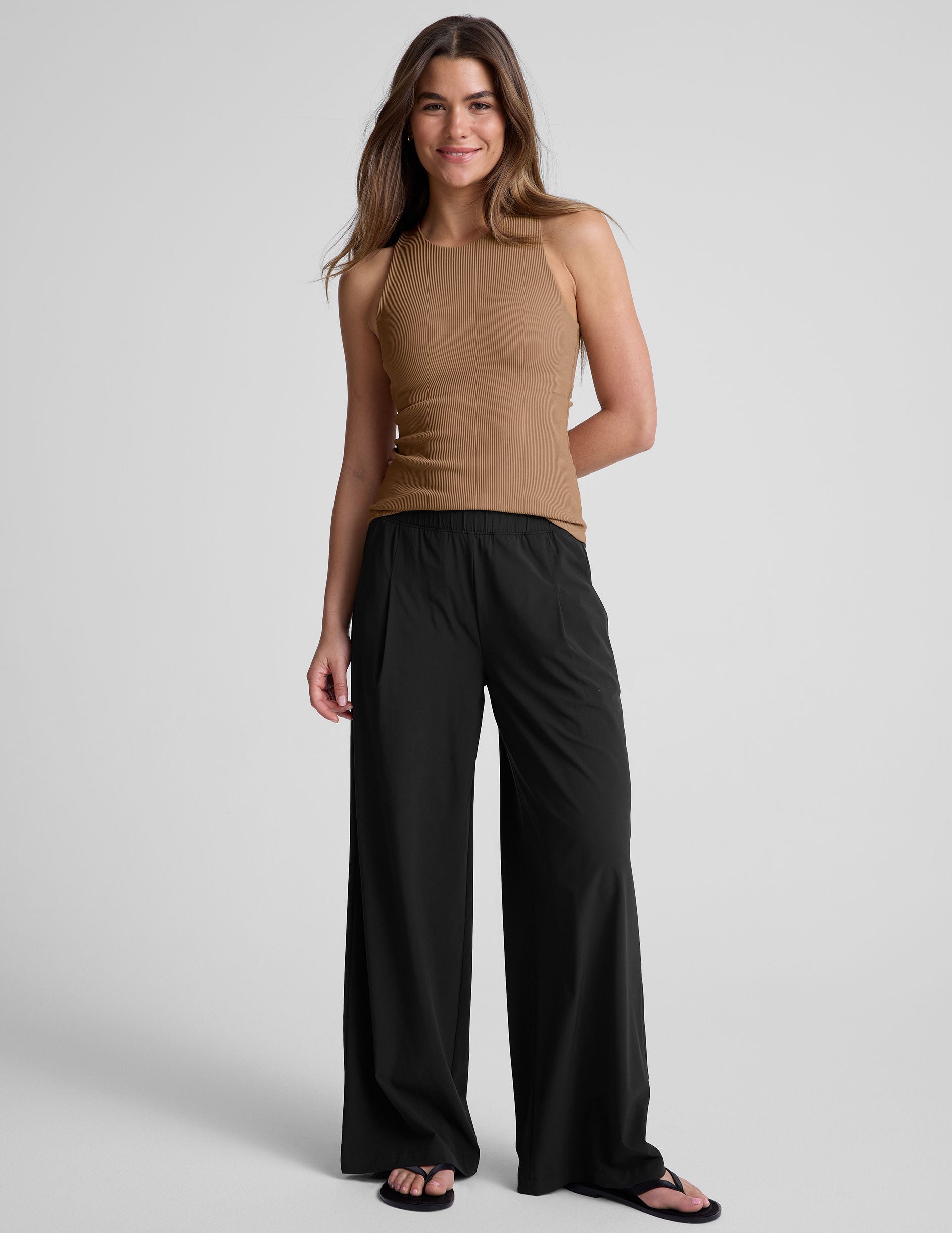 brown ribbed high-neck classic length tank top.