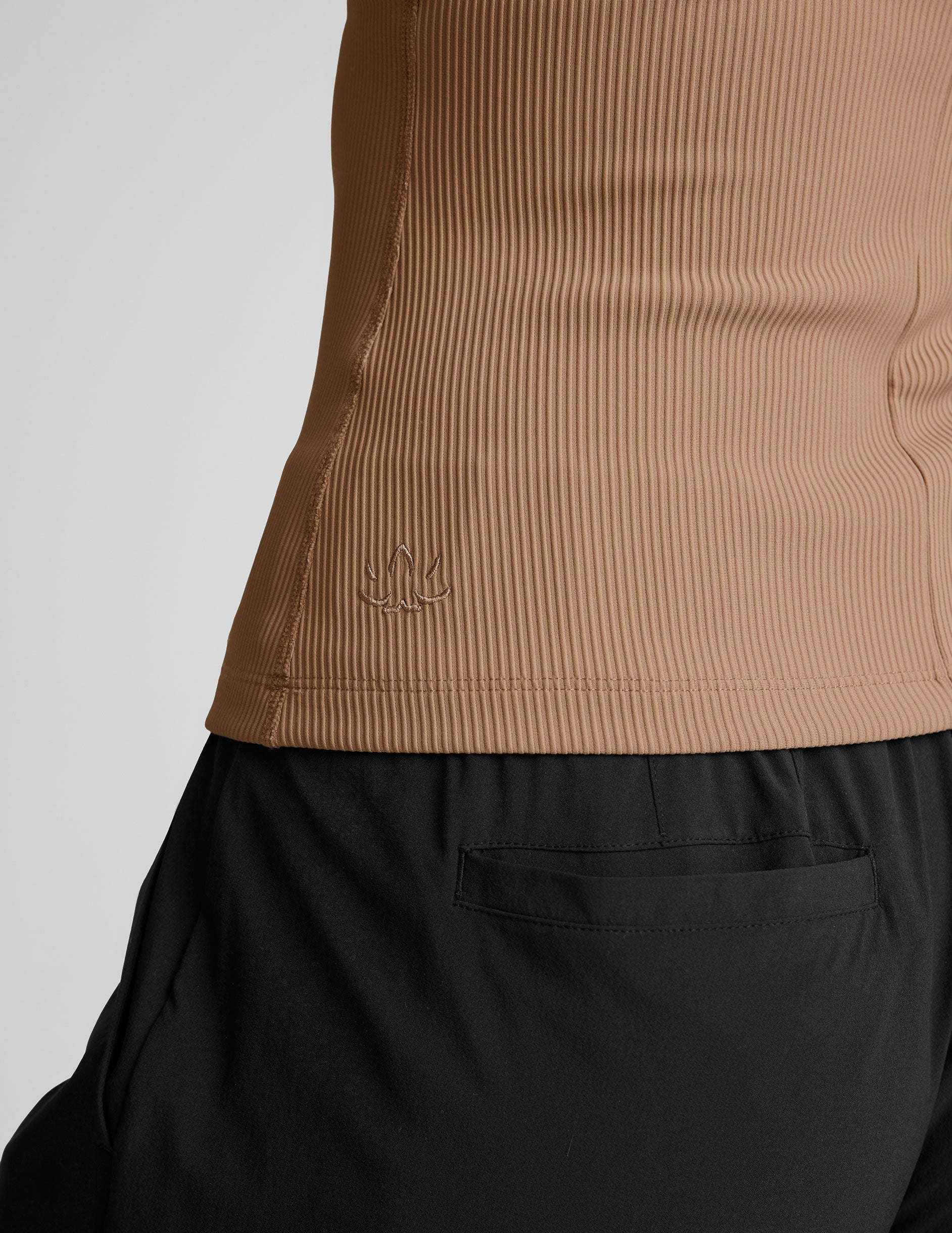 brown ribbed high-neck classic length tank top.