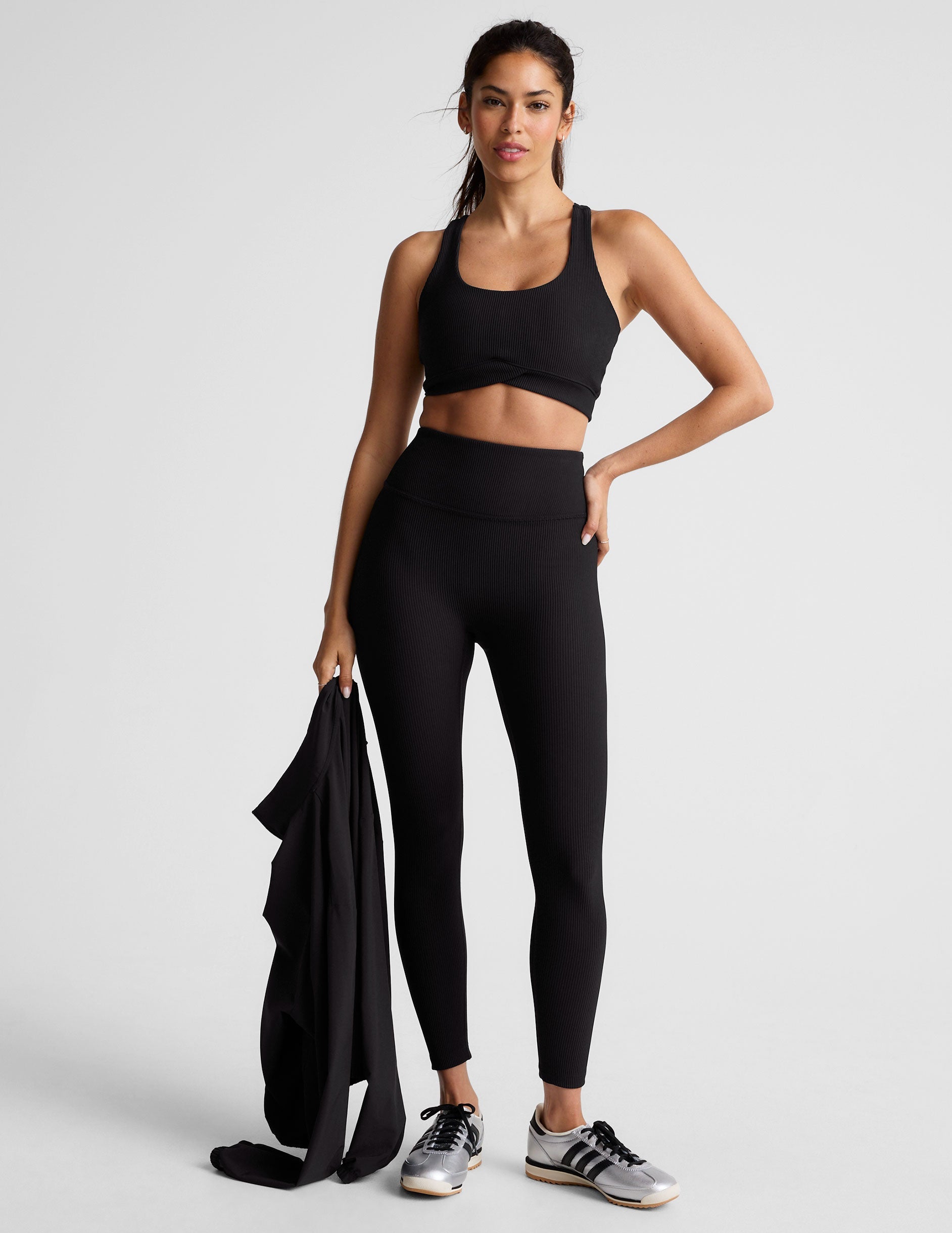 black ribbed racerback bra with overlapping hemband detail​ and a scoop neckline.