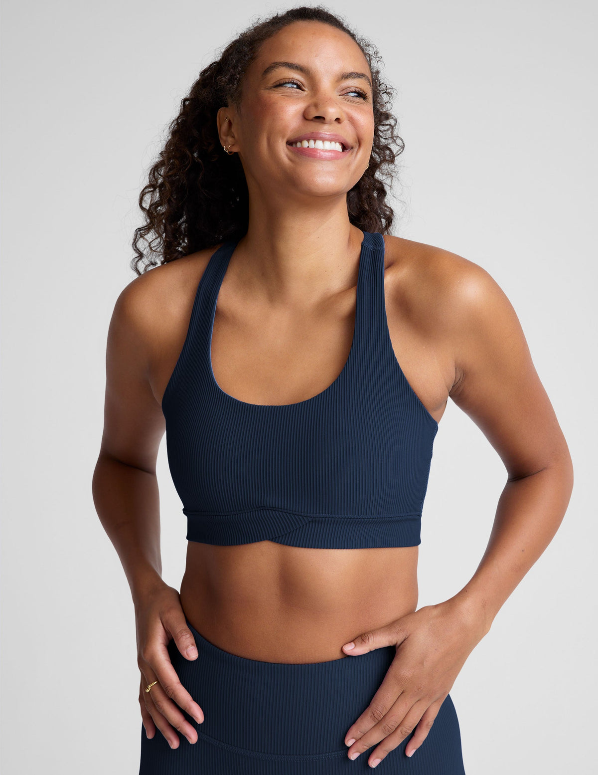 blue racerback bra with a scoop neckline​
and overlapping hemband detail​. 