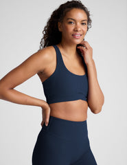 blue racerback bra with a scoop neckline​
and overlapping hemband detail​. 