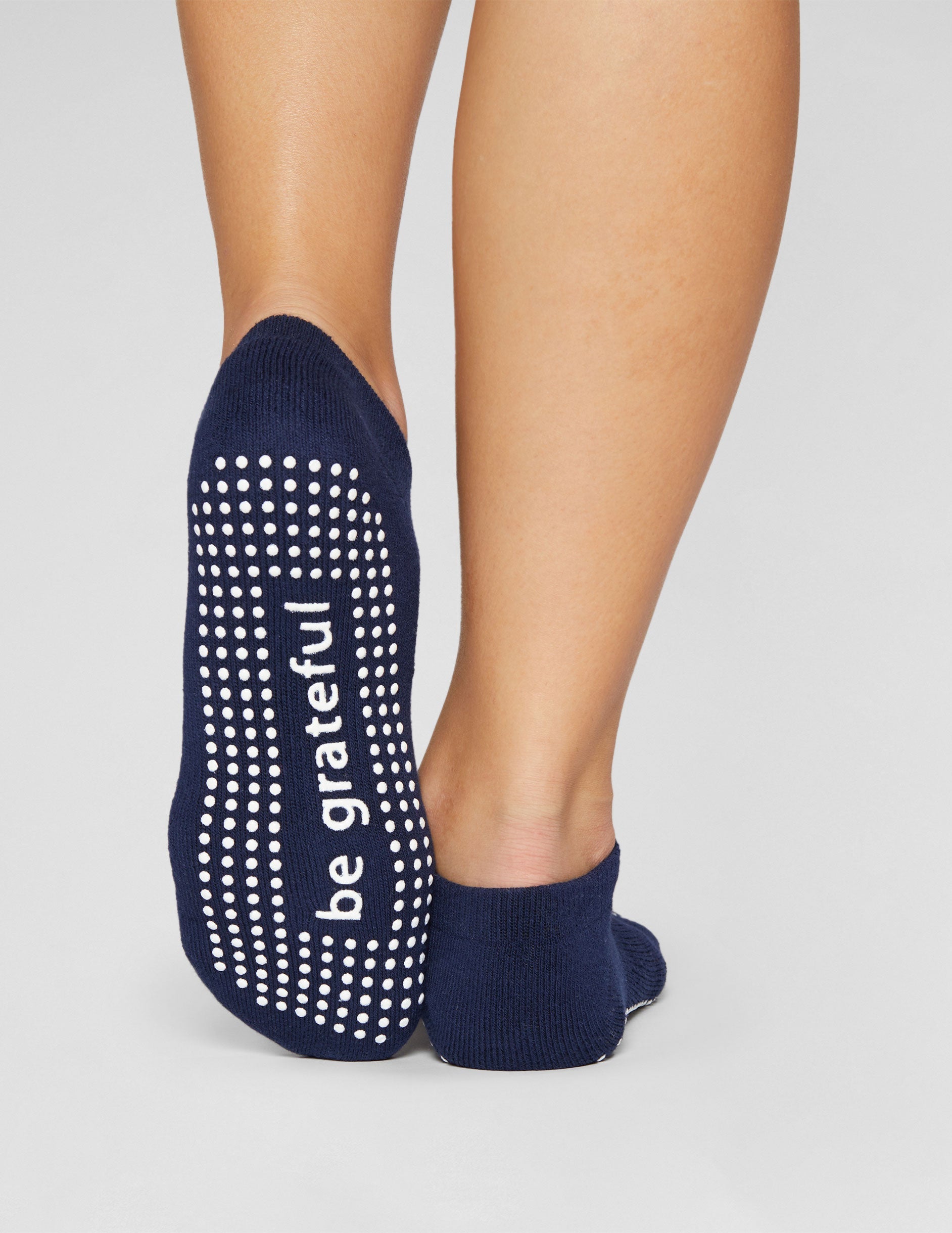 blue ankle length grip socks.