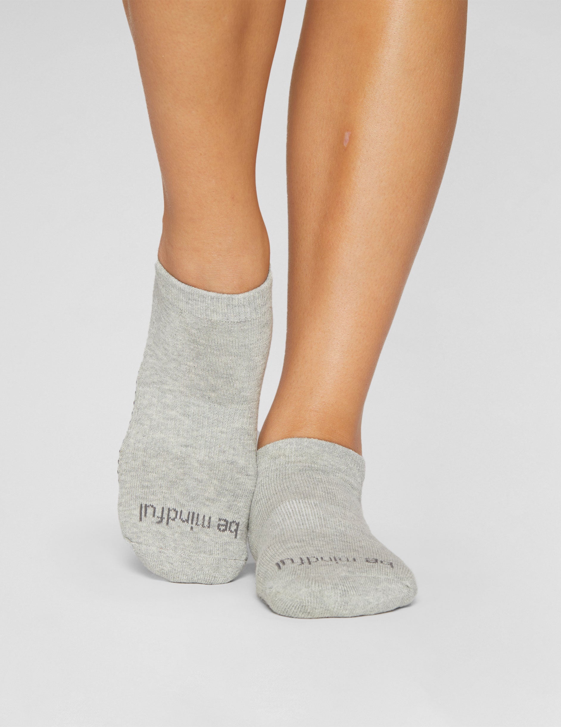 grey ankle grip socks.