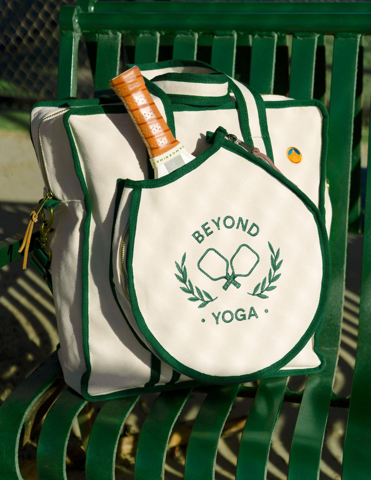 green and white beyond yoga pickleball tote bag.