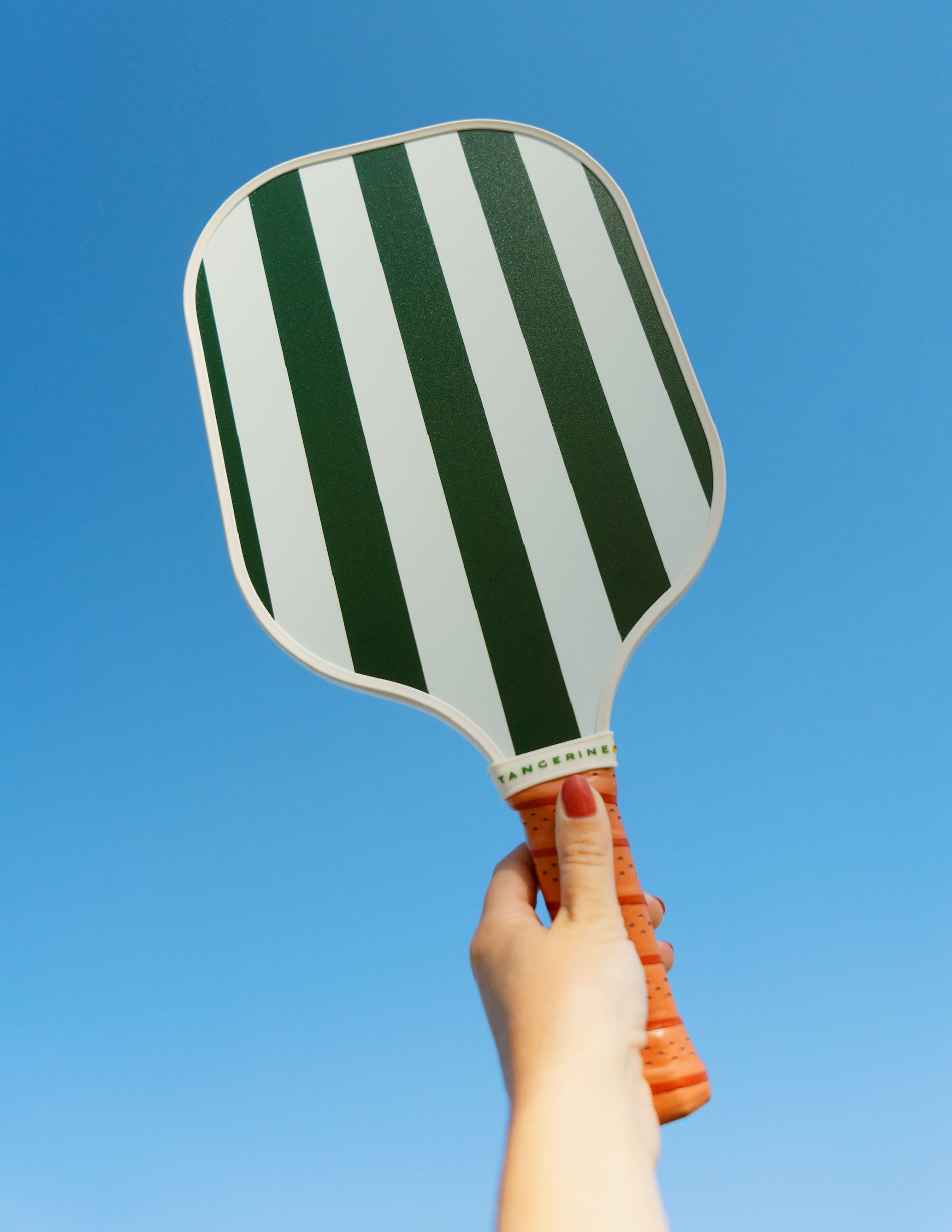 beyond yoga green and white stripped pickle-ball paddle.