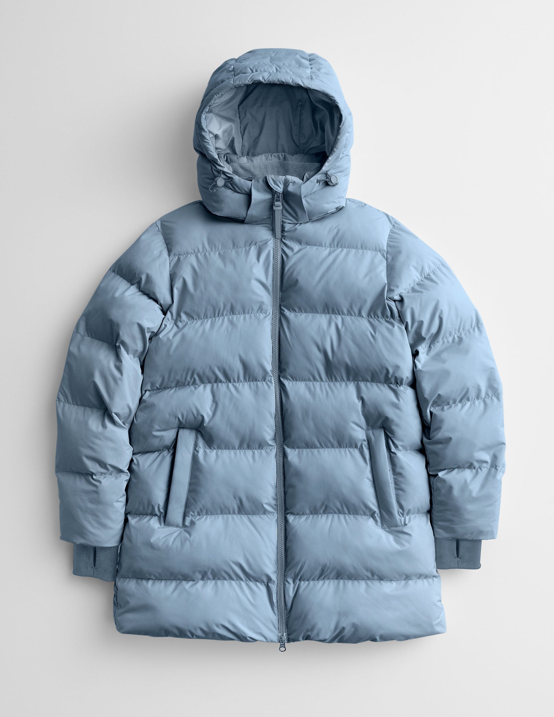 Blue puffer jacket on a light gray background.