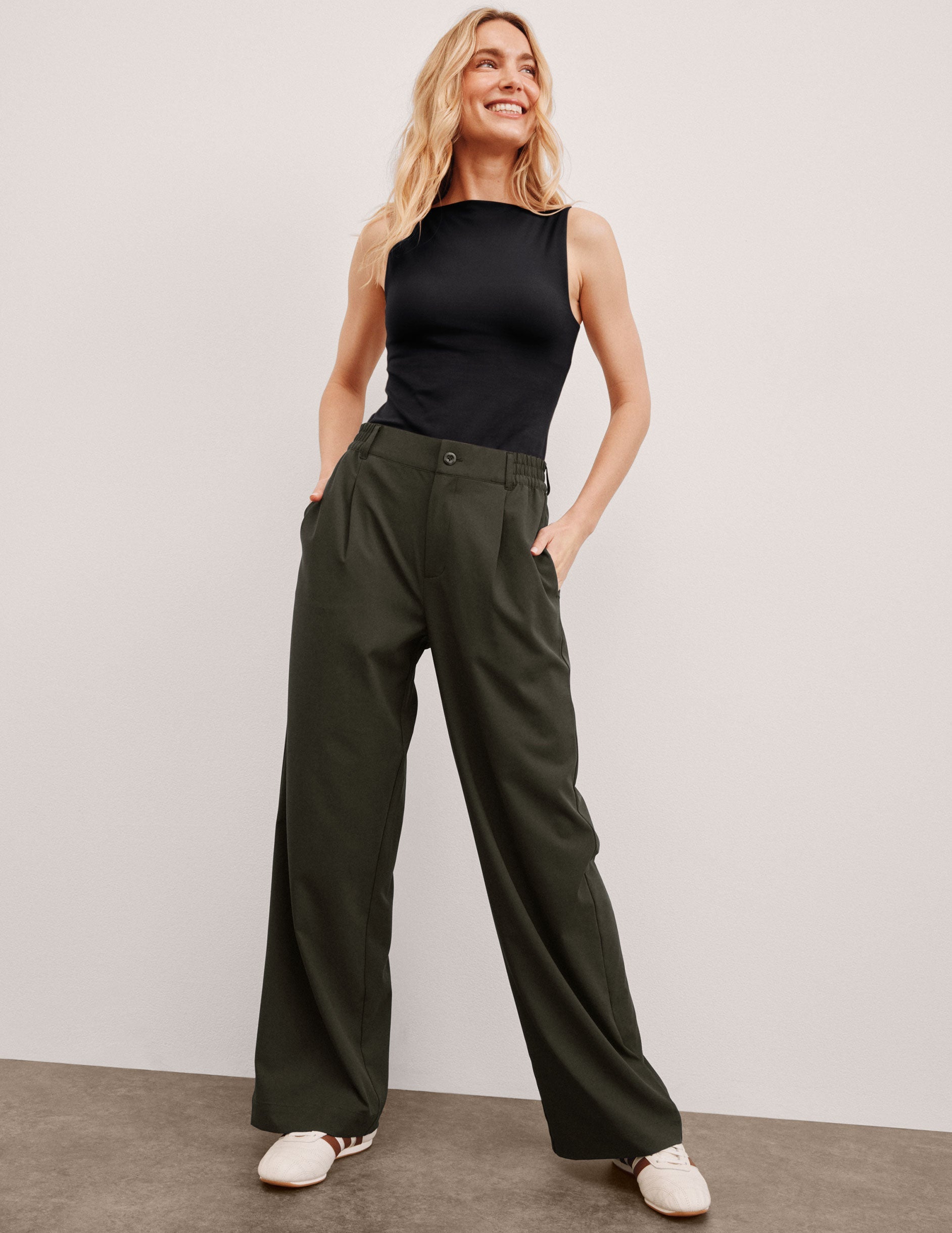 green trouser pants with pockets.