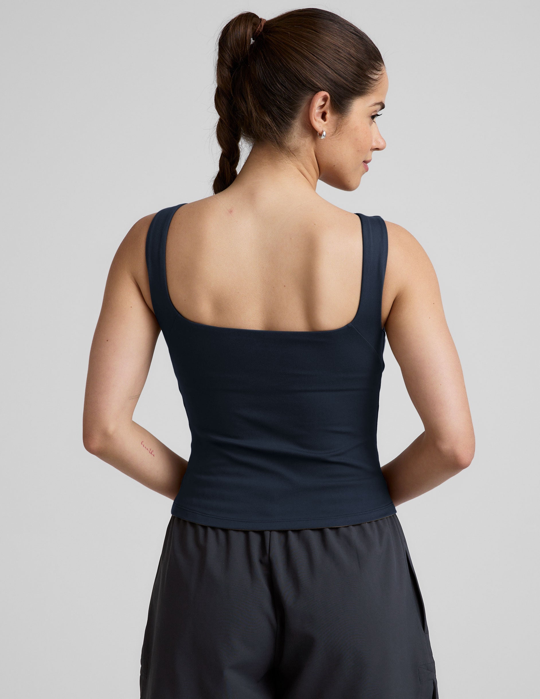 blue boat neck tank top with a square back neckline.